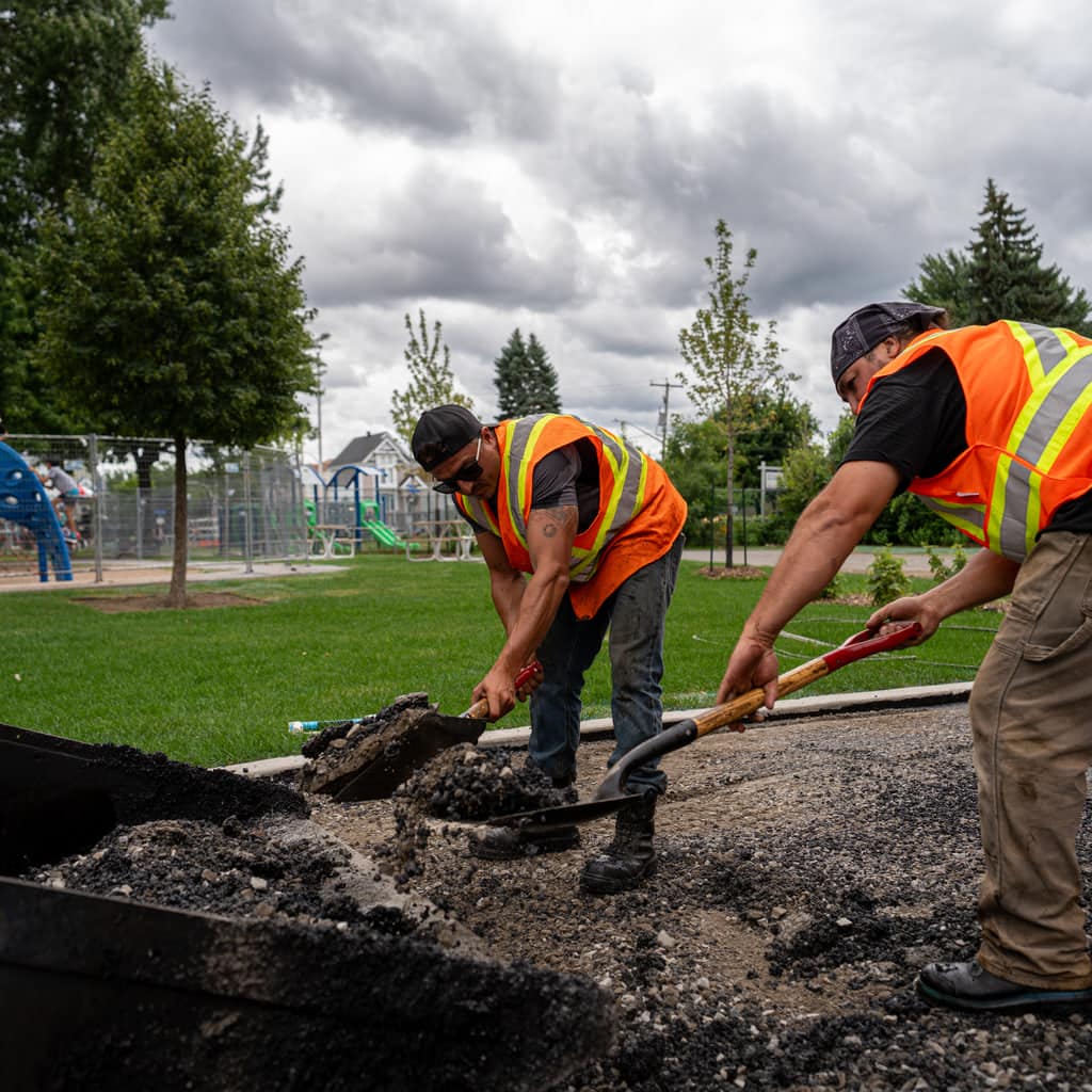 Groupe A1 crew repairing a damaged asphalt area