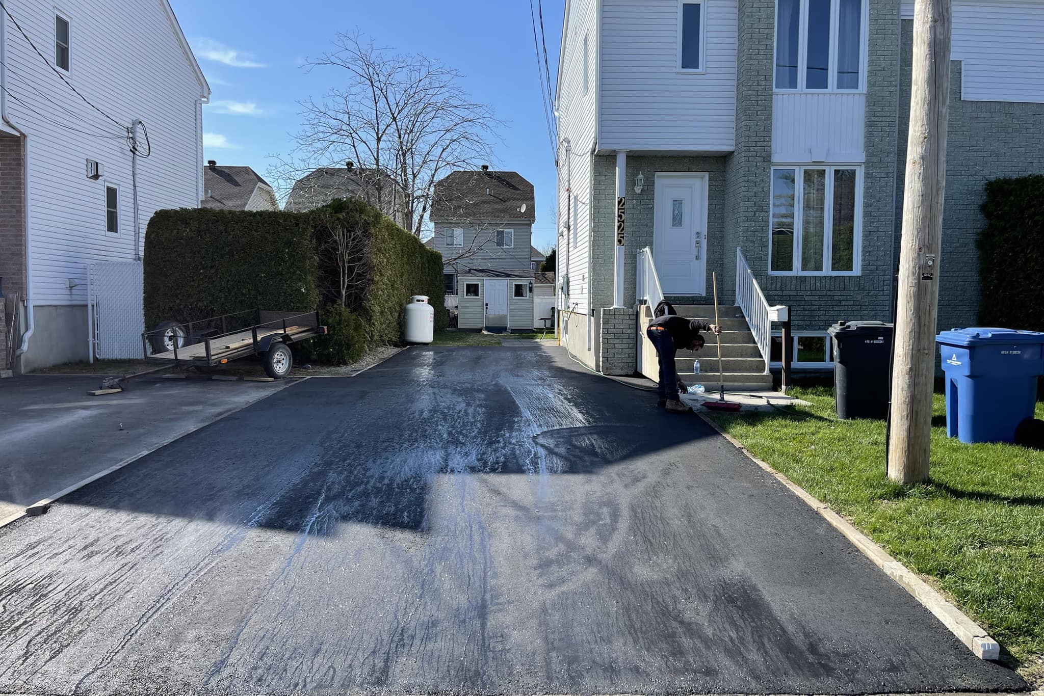 Freshly paved residential asphalt driveway